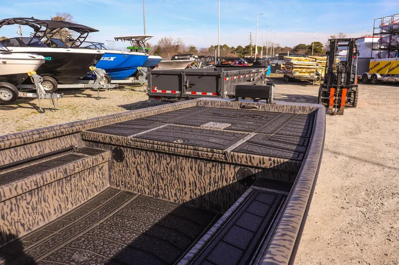 Slide: The Image of 2026 Gator Tail 1860 Extreme series boat in a dealership lot with other boats. - 10