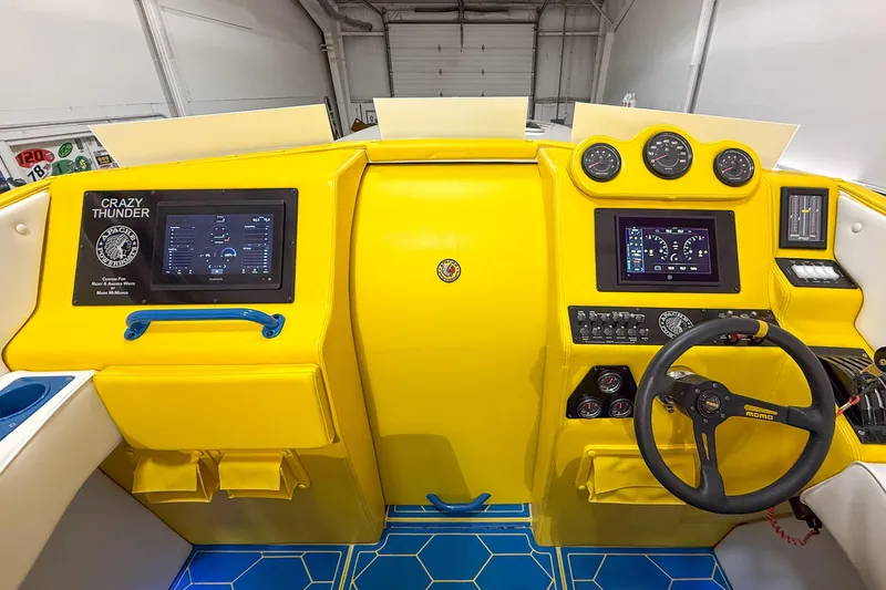 Slide: The Image of Yellow dashboard of a 1998 Apache 36 WARRIOR boat with modern gauges and controls. - 10