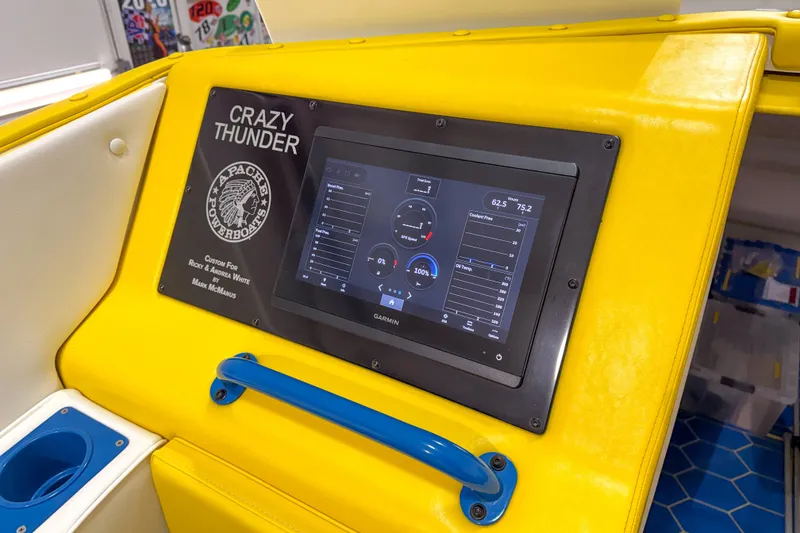 Slide: The Image of Control panel of 1998 Apache 36 WARRIOR boat, featuring "Crazy Thunder" display. - 11