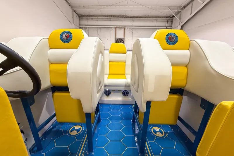 Slide: The Image of Interior of a 1998 Apache 36 WARRIOR boat with yellow and white seating. - 13
