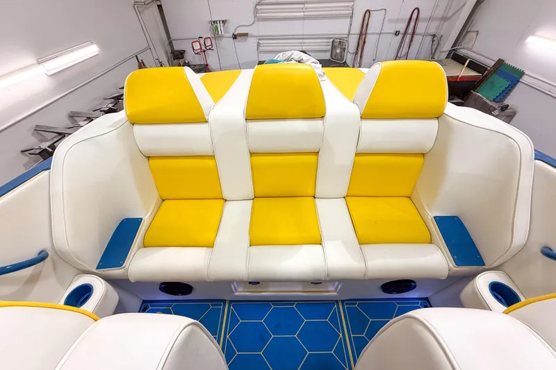 Slide: The Image of Yellow and white seating on a 1998 Apache 36 WARRIOR boat interior. - 16