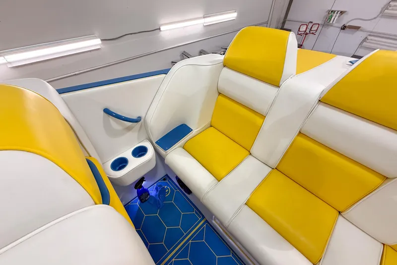 Slide: The Image of Interior of 1998 Apache 36 WARRIOR boat with yellow and white seating. - 17