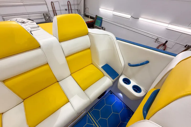 Slide: The Image of Yellow and white seating in 1998 Apache 36 WARRIOR boat interior. - 18