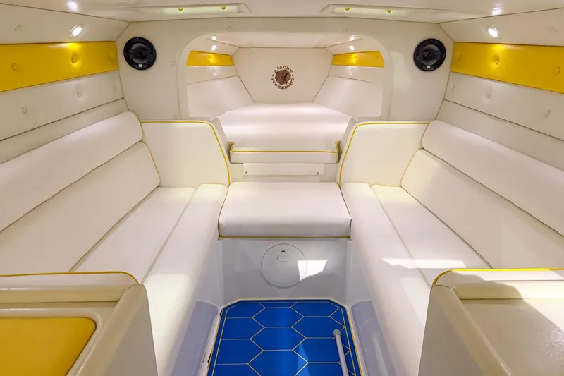 Slide: The Image of Luxurious interior of 1998 Apache 36 WARRIOR boat with white and yellow seating. - 21