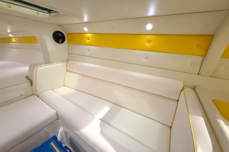 Slide: The Image of Interior of 1998 Apache 36 WARRIOR boat with white and yellow seating. - 22