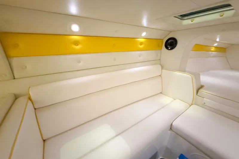 Slide: The Image of Interior of 1998 Apache 36 WARRIOR boat with white and yellow seating. - 23