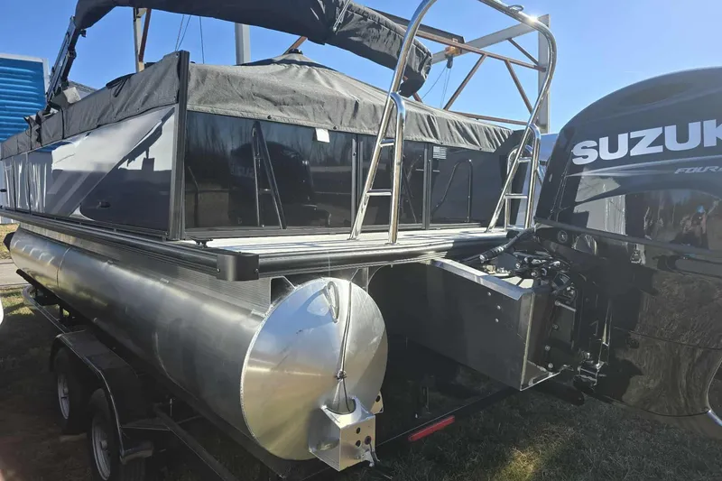 Slide: The Image of Dockside 22DQ17.5 pontoon boat, 2026 model, with Suzuki outboard motor. - 2
