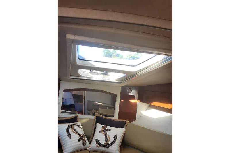 Slide: The Image of Close-up of 2012 Sea Ray 310 Sundancer propeller and stern drive in marina. - 10