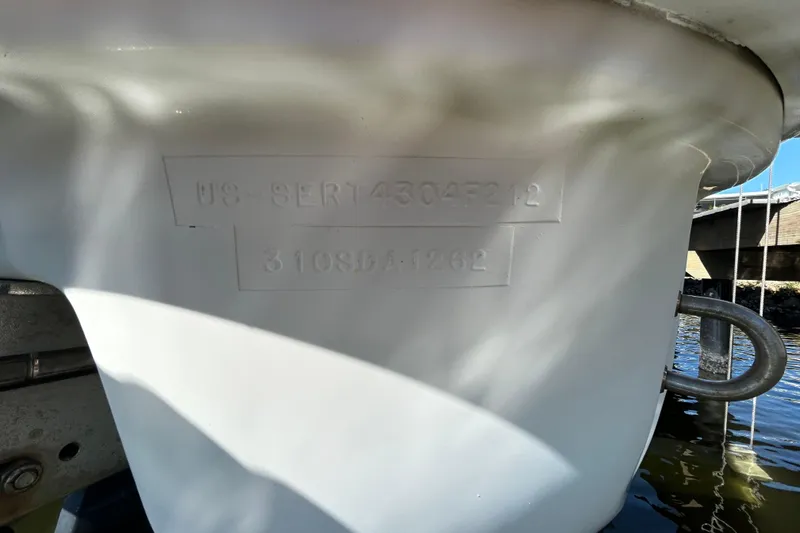 Slide: The Image of White hatch with chrome handle on 2012 Sea Ray Sundancer 310 boat. - 103