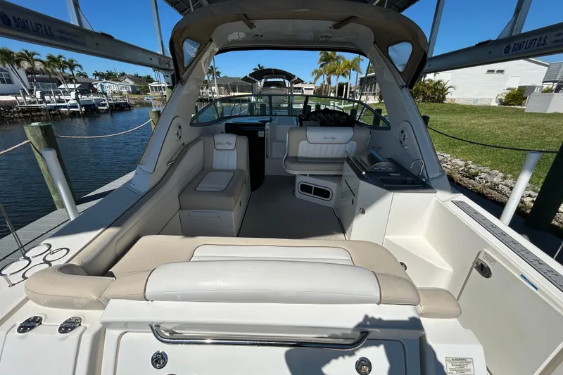 Slide: The Image of Electrical panel inside 2012 Sea Ray Sundancer 310 boat, showing wiring and fuses. - 105