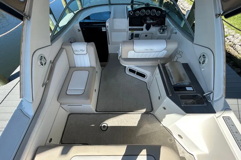Slide: The Image of White cooler stored in a compartment on a 2012 Sea Ray Sundancer 310 boat. - 108