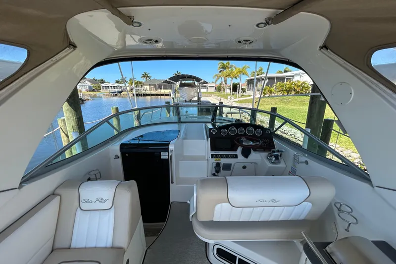 Slide: The Image of 2012 Sea Ray Sundancer 310 boat deck, docked by calm waters. - 112