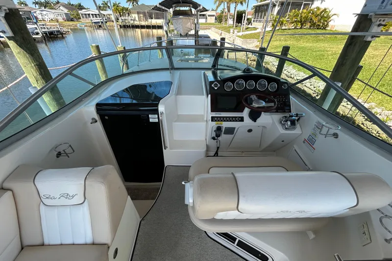 Slide: The Image of Bow of 2012 Sea Ray Sundancer 310 docked, featuring anchor and deck details. - 114