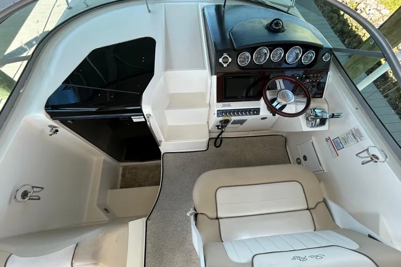 Slide: The Image of 2012 Sea Ray Sundancer 310 anchor compartment with open hatch and dock view. - 115