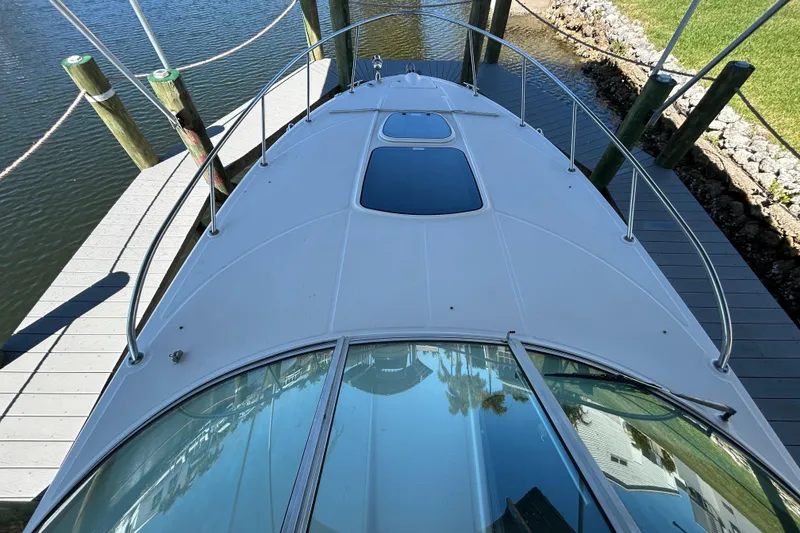 Slide: The Image of Cabin entrance of 2012 Sea Ray Sundancer 310 boat with warning labels. - 119