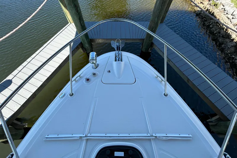 Slide: The Image of Wooden cabinet with metal handle in 2012 Sea Ray Sundancer 310 interior. - 124