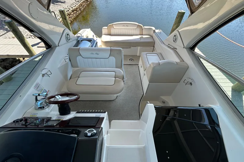 Slide: The Image of Beige leather seating in 2012 Sea Ray Sundancer 310 boat interior. - 135