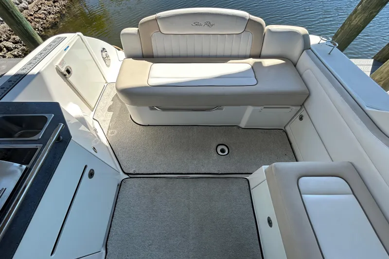 Slide: The Image of Beige leather seating in 2012 Sea Ray Sundancer 310 boat interior. - 139