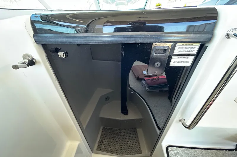 Slide: The Image of Wooden interior paneling on a 2012 Sea Ray Sundancer 310 boat. - 142