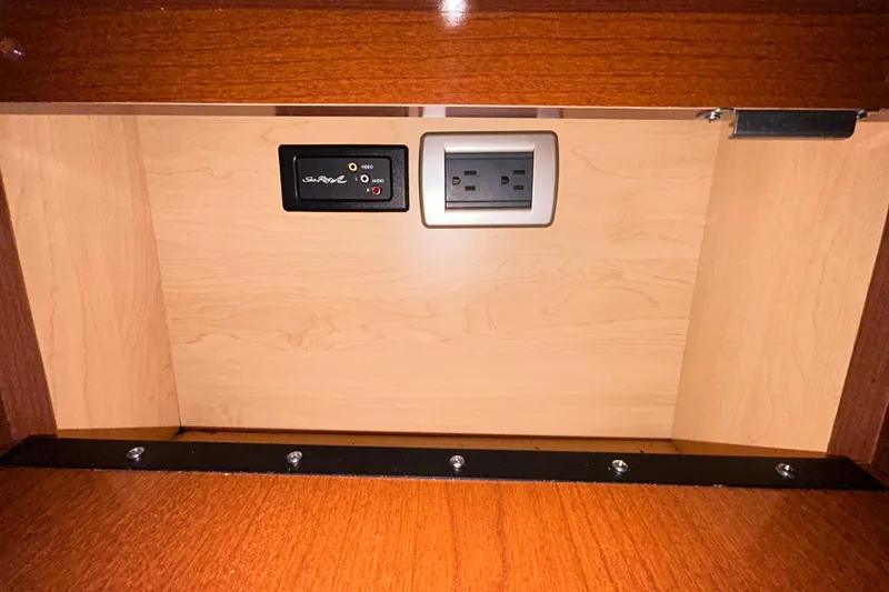 Slide: The Image of Battery compartment of a 2012 Sea Ray Sundancer 310 boat with wiring and components. - 149