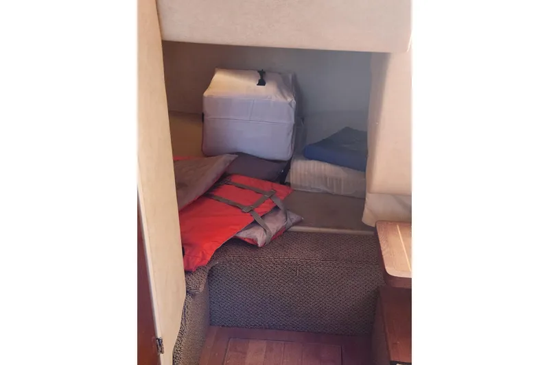 Slide: The Image of 2012 Sea Ray 310 Sundancer docked by a sunny waterfront. - 15