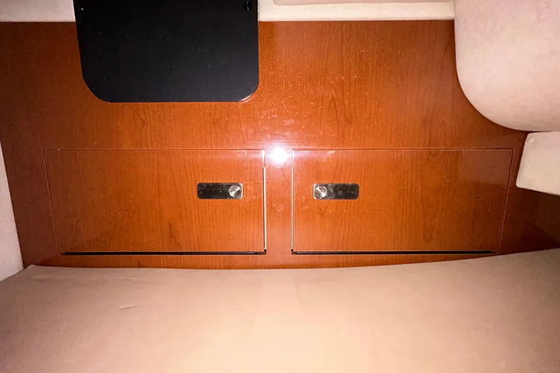 Slide: The Image of Wooden interior paneling of a 2012 Sea Ray Sundancer 310 boat. - 151