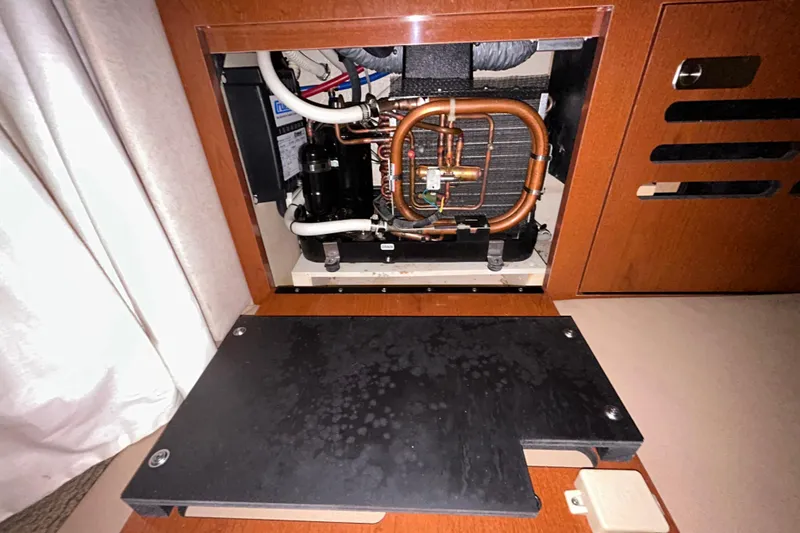 Slide: The Image of Wooden floor with metal fixture on 2012 Sea Ray Sundancer 310 boat. - 156