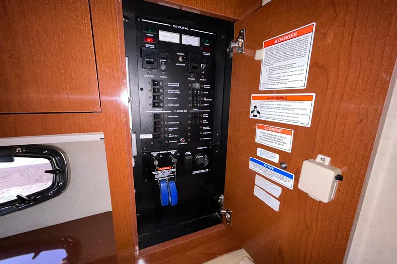 Slide: The Image of 2012 Sea Ray Sundancer 310 interior cabinet with wood finish and countertop. - 169