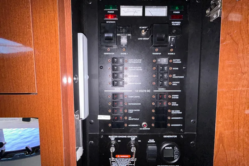 Slide: The Image of 2012 Sea Ray Sundancer 310 interior with fridge, fire extinguisher, and storage cabinet. - 170