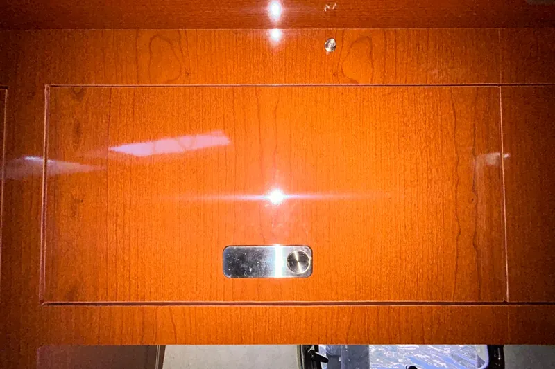 Slide: The Image of Interior cabinetry of 2012 Sea Ray Sundancer 310 yacht with wood finish and microwave. - 173