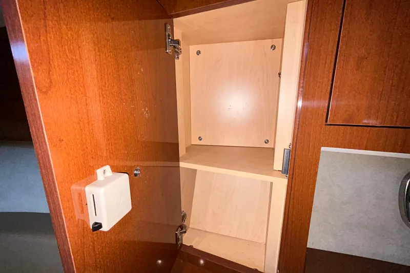 Slide: The Image of Interior of 2012 Sea Ray Sundancer 310 yacht, featuring a compact bathroom and seating area. - 176