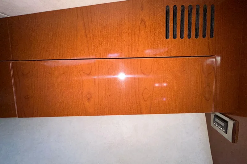 Slide: The Image of Cabinet doors inside a 2012 Sea Ray Sundancer 310 boat interior. - 178
