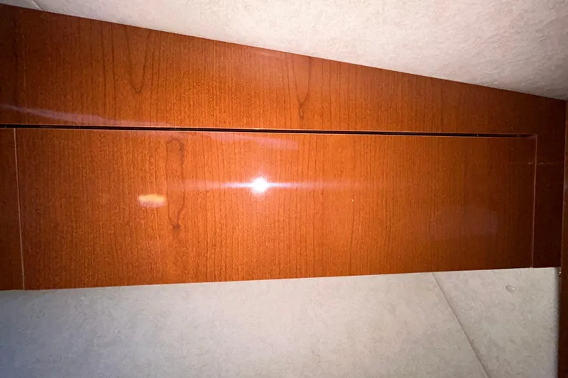 Slide: The Image of Interior compartment of 2012 Sea Ray Sundancer 310 boat, featuring storage space. - 182