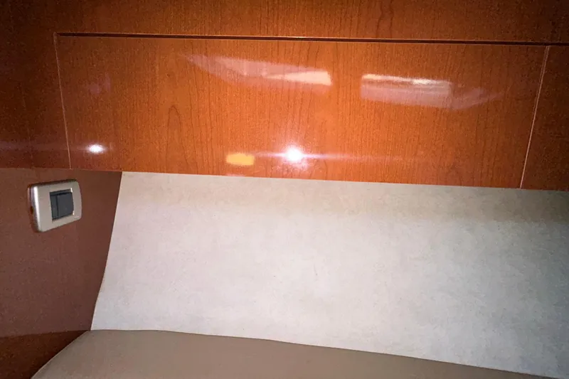 Slide: The Image of Wooden hatch on 2012 Sea Ray Sundancer 310 boat, surrounded by carpeted walls. - 184