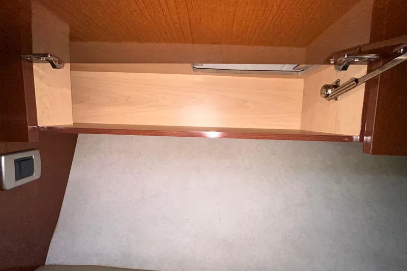 Slide: The Image of Bilge compartment of 2012 Sea Ray Sundancer 310 with wiring and pump visible. - 185