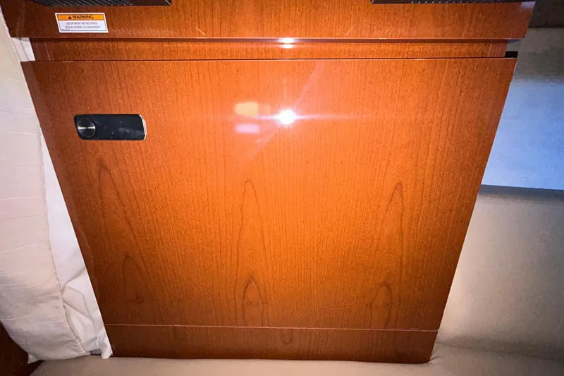 Slide: The Image of Bilge compartment of 2012 Sea Ray Sundancer 310 with wiring and pump visible. - 186