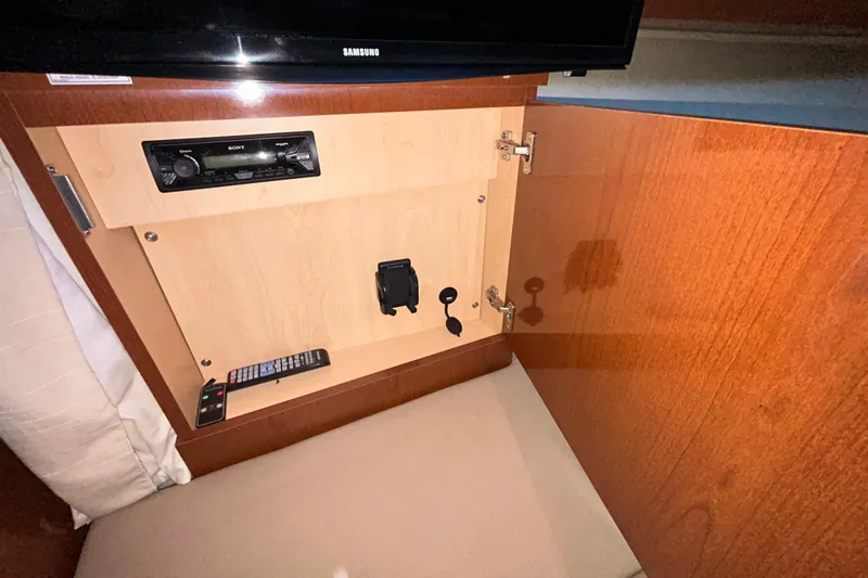 Slide: The Image of Interior cabin space of 2012 Sea Ray Sundancer 310 yacht, featuring carpeted flooring. - 187