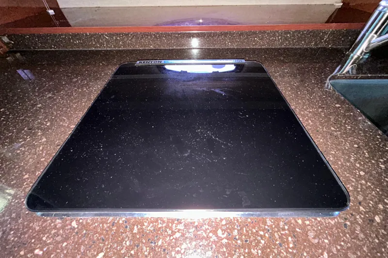 Slide: The Image of Wooden cabinet with vented panel inside a 2012 Sea Ray Sundancer 310 boat. - 194