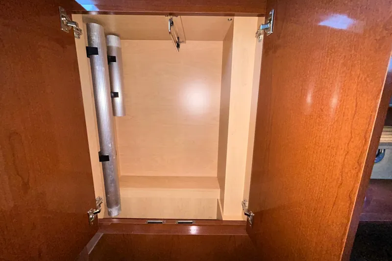 Slide: The Image of Interior cabin storage of 2012 Sea Ray Sundancer 310 boat with wooden finish. - 197