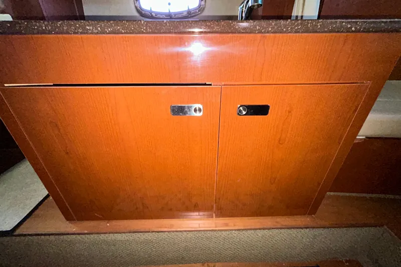 Slide: The Image of Interior storage compartments on a 2012 Sea Ray Sundancer 310 boat. - 198