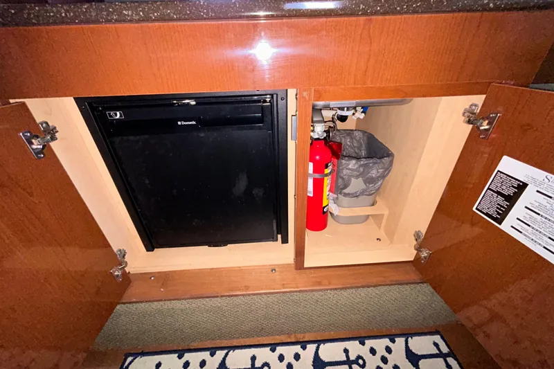 Slide: The Image of 2012 Sea Ray Sundancer 310 interior with power outlet and video/audio panel. - 199