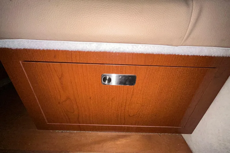 Slide: The Image of Kohler generator display showing 106.7 hours on a 2012 Sea Ray Sundancer 310. - 202