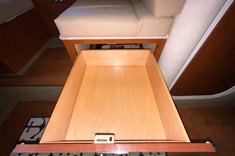 Slide: The Image of Engine compartment of a 2012 Sea Ray Sundancer 310 with Mercury MerCruiser specifications. - 203