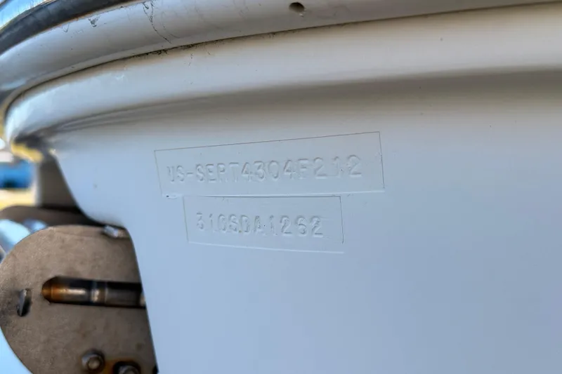Slide: The Image of Hull identification number on 2012 Sea Ray 310 Sundancer boat. - 21