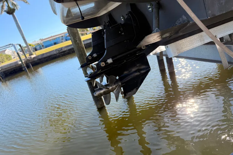 Slide: The Image of 2012 Sea Ray 310 Sundancer boat propeller above water, reflecting sunlight. - 22