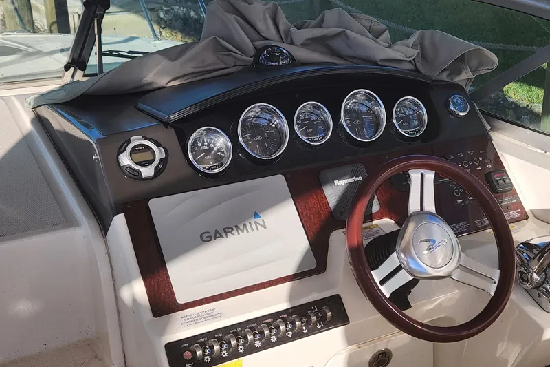 Slide: The Image of 2012 Sea Ray 310 Sundancer boat named "Skimmer" docked in Punta Gorda, Florida. - 3