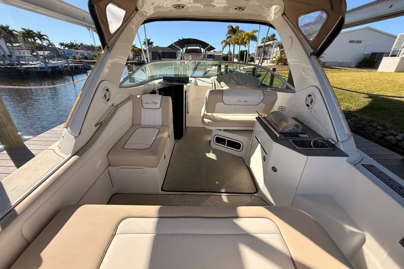 Slide: The Image of Interior view of 2012 Sea Ray 310 Sundancer boat with seating and kitchenette. - 33
