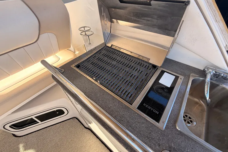 Slide: The Image of Outdoor grill and sink on 2012 Sea Ray 310 Sundancer boat deck. - 38