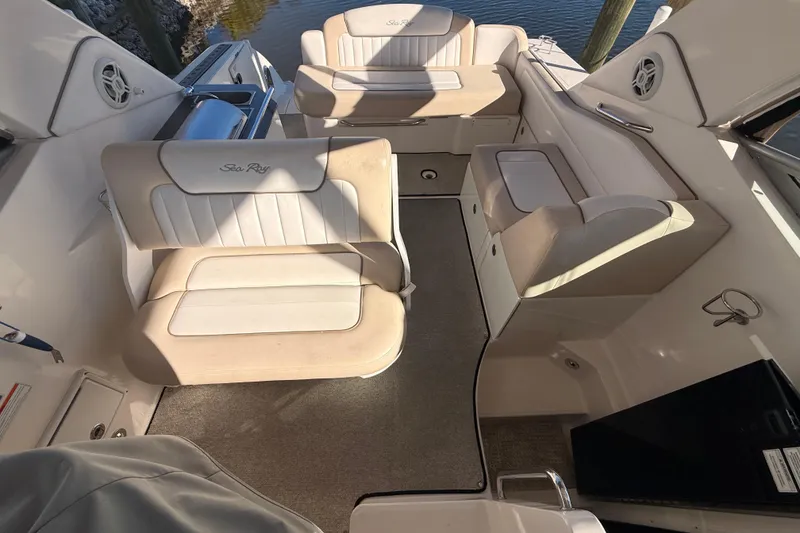 Slide: The Image of Interior of 2012 Sea Ray 310 Sundancer boat with beige seating and carpet. - 41