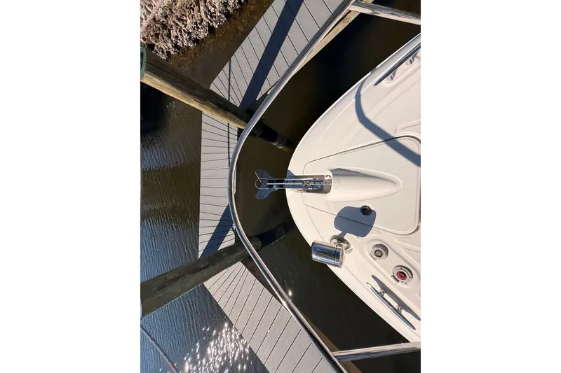 Slide: The Image of Bow of 2012 Sea Ray 310 Sundancer docked at marina. - 45